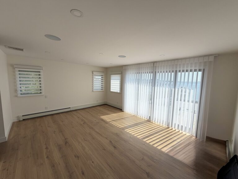 Norman PerfectSheer in Soft White and Norman SmartDrape in Lakeshore Stripe White - Primary Bedroom